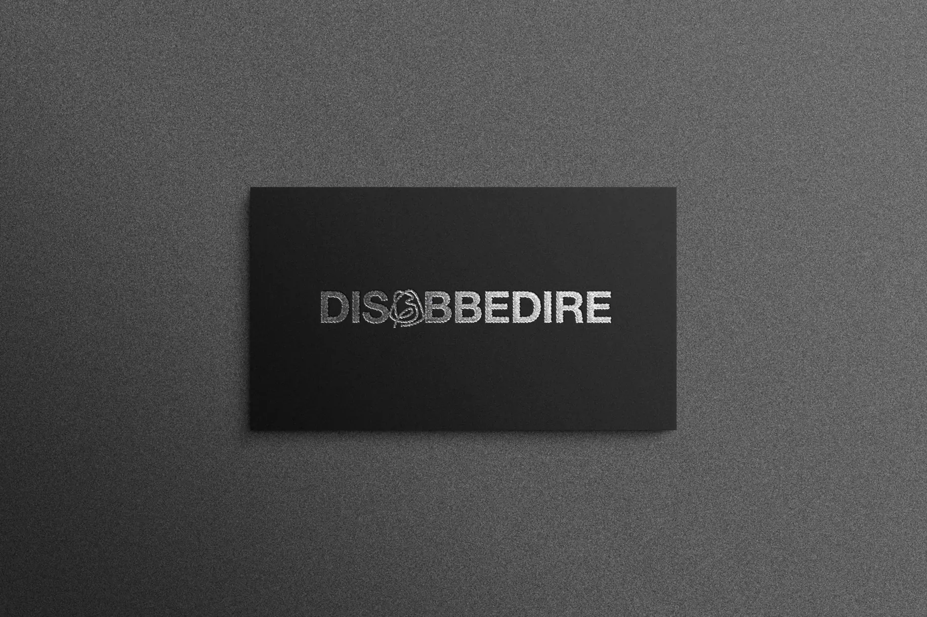 Identita Disobbedire, biglietto nero con logotipo argento
